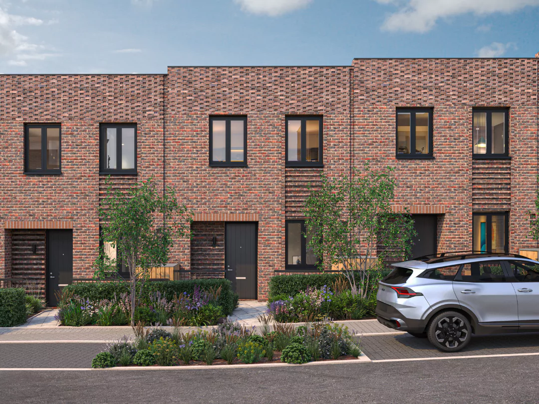 A row of welcoming red-brick Boxkite homes with unique brickwork detailing at Brabazon.