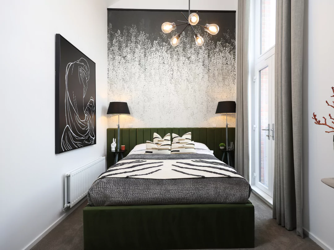 Moody styled primary double bedroom flooded with natural light from the double height windows and patio doors.