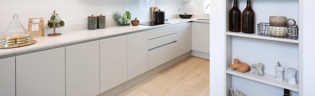 Property with a modern grey kitchen and light wood flooring at Brabazon.