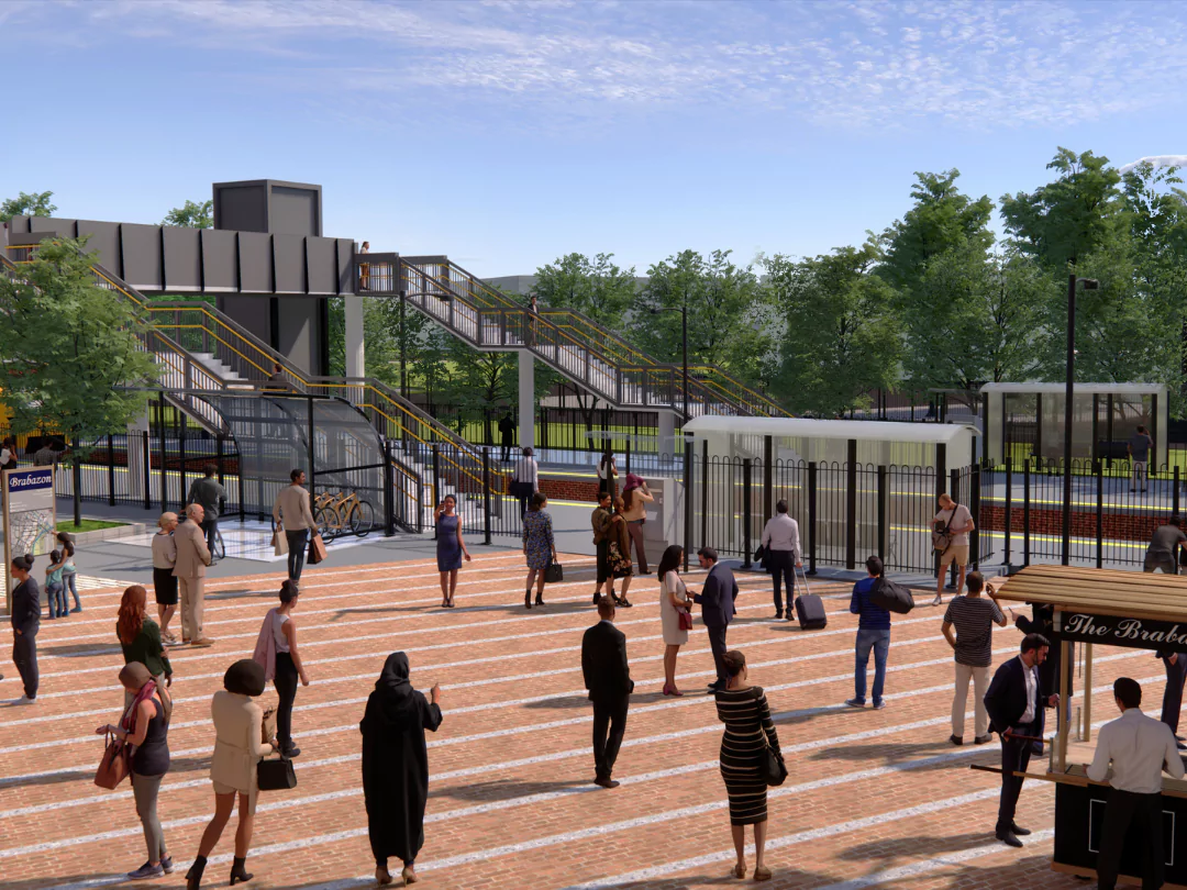 A busy train station situated in Brabazon, packed with commuters on a bright sunny day.